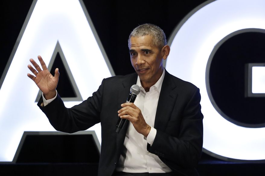 FILE - In this Feb. 15, 2020, file photo, former President Barack Obama talks during a panel with NBA players Chris Paul, Kevin Love and Giannis Antetokounmpo and sports analyst Michael Wilbon in Chicago. Obama tipped his cap. So did three other former presidents and a host of prominent civil rights leaders, entertainers and sports legends in a virtual salute to the 100-year anniversary of the founding of baseball’s Negro Leagues. The campaign launched Monday, June 29, 2020, with photos and videos from, among others, Hank Aaron, Rachel Robinson Derek Jeter, Colin Powell, Michael Jordan, Obama and presidents George W. Bush, Bill Clinton and Jimmy Carter at tippingyourcap.com. (AP Photo/Nam Y. Huh, File)