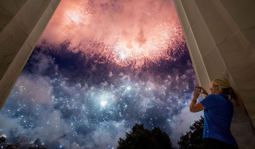 FILE - In this July 4, 2019, file photo, fireworks seen from the Lincoln Memorial explode over the Potomac River in Washington. President Donald Trump is moving ahead with a lower-key “Salute to America" celebration this year on July Fourth, despite concerns from some lawmakers about the crowds the event could generate during the coronavirus pandemic. (AP Photo/Andrew Harnik, File)