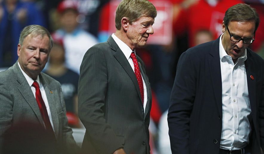 FILE - In this Thursday, Feb. 20, 2020, file photo, from left, U.S. Rep. Doug Lanborn, R-Colo., U.S. Rep. Scott Tipton, R-Colo., follow Todd Ricketts, finance chairman of the Republican National Committee, off the stage as President Donald Trump speaks at a campaign rally in Colorado Springs, Colo. Tipton was defeated by right-wing primary challenger Lauren Boebert in Colorado's 3rd congressional district primary, Tuesday, June 30, 2020. (AP Photo/David Zalubowski, File)