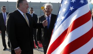 FILE - In this March 20, 2019, file photo, U.S. Secretary of State Mike Pompeo meets U.S. Ambassador to Israel David Friedman upon his arrival at Ben Gurion International Airport, near Tel Aviv, Israel. The U.S. State Department has put the ambassador to Israel&#39;s official residence outside Tel Aviv up for sale, in a decision aimed at cementing the American embassy&#39;s controversial move to Jerusalem. The beachfront mansion in the affluent Tel Aviv suburb of Herzliya is going on the market because most of Ambassador David Friedman’s day-to-day activities are based at the embassy in Jerusalem, the State Department said Tuesday, June 30, 2020. (Jim Young/Pool Photo via AP, File)