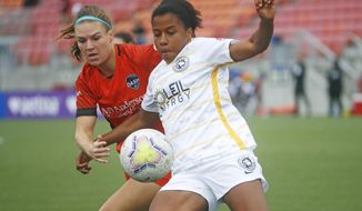 Utah Royals FC defender Elizabeth Ball, right, battles with Houston Dash forward Veronica Latsko for the ball during the first half of an NWSL Challenge Cup soccer match at Zions Bank Stadium Tuesday, June 30, 2020, in Herriman, Utah. (AP Photo/Rick Bowmer)
