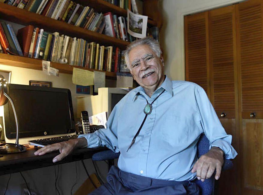In this June 6, 2016 image, New Mexico author Rudolfo Anaya poses for a photograph in his home writing studio. Anaya, who helped launch the 1970s Chicano literature movement with his novel "Bless Me, Ultima," died Sunday, June 28, 2020, after a long illness. He was 82. (Dean Hanson/Albuquerque Journal via AP)