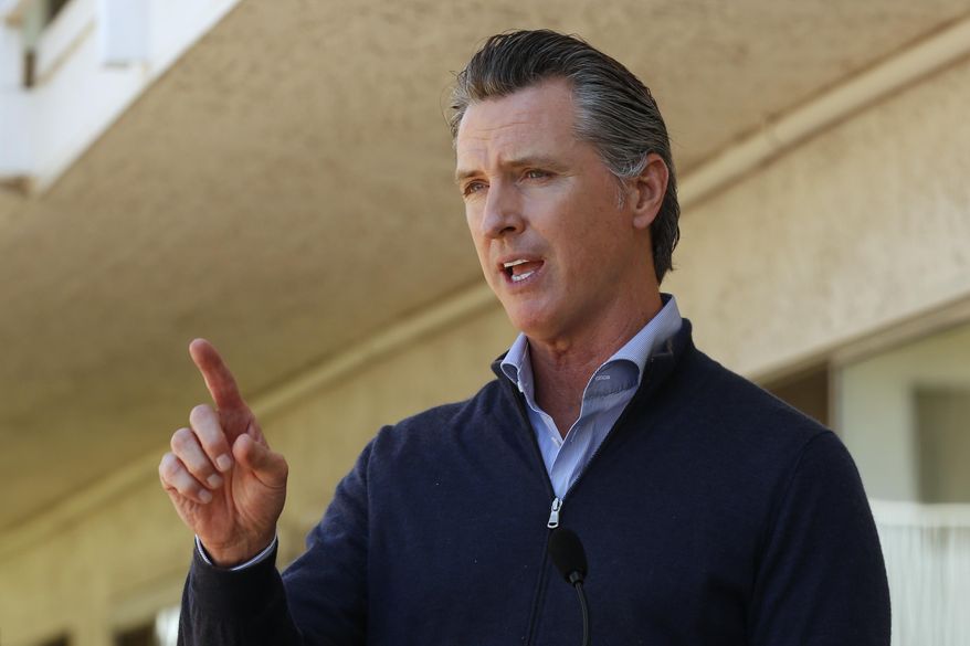 Gov. Gavin Newsom gives an update on the state&#39;s initiative to provide housing for homeless Californians to help stem the coronavirus, during a visit to a Motel 6 participating in the program in Pittsburg, Calif., Tuesday, June 30, 2020. Newsom announced that more than 15,000 rooms have been acquired and more than 14,000 people have been given places to stay statewide under the Project Room key program started in April. The governor also said he plans to announce on Wednesday plans to &amp;quot;toggle back&amp;quot; the states stay-at-home order. (AP Photo/Rich Pedroncelli, Pool)
