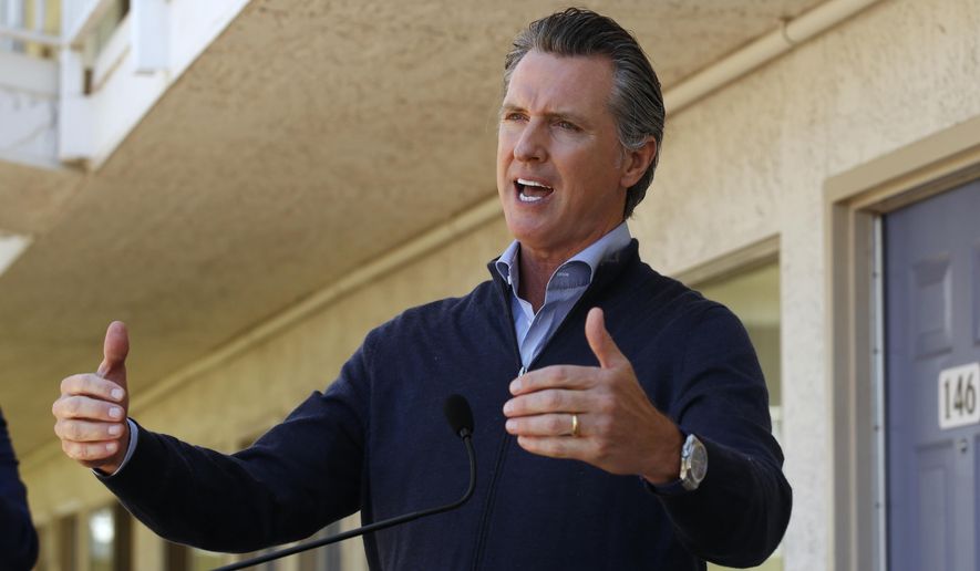 Gov. Gavin Newsom gives an update on the state&#x27;s initiative to provide housing for homeless Californians to help stem the coronavirus, during a visit to a Motel 6 participating in the program in Pittsburg, Calif., Tuesday, June 30, 2020. Newsom announced that more than 15,000 rooms have been acquired and more than 14,000 people have been given places to stay statewide under the Project Room key program started in April. The governor also said he plans to announce on Wednesday plans to &amp;quot;toggle back&amp;quot; the states stay-at-home order. (AP Photo/Rich Pedroncelli, Pool)