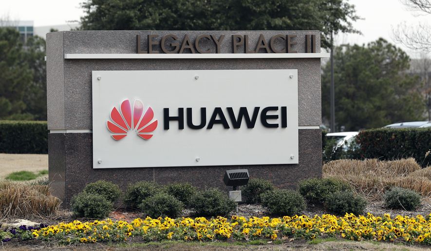 FILE - In this March 7, 2019, file photo, a sign is displayed outside the Huawei Technologies Ltd. business location in Plano, Texas. China on Wednesday, July 1, 2020 demanded Washington stop “oppressing Chinese companies” after U.S. regulators declared telecom equipment suppliers Huawei and ZTE to be national security threats. (AP Photo/Tony Gutierrez, File)