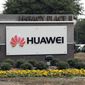FILE - In this March 7, 2019, file photo, a sign is displayed outside the Huawei Technologies Ltd. business location in Plano, Texas. China on Wednesday, July 1, 2020 demanded Washington stop “oppressing Chinese companies” after U.S. regulators declared telecom equipment suppliers Huawei and ZTE to be national security threats. (AP Photo/Tony Gutierrez, File)