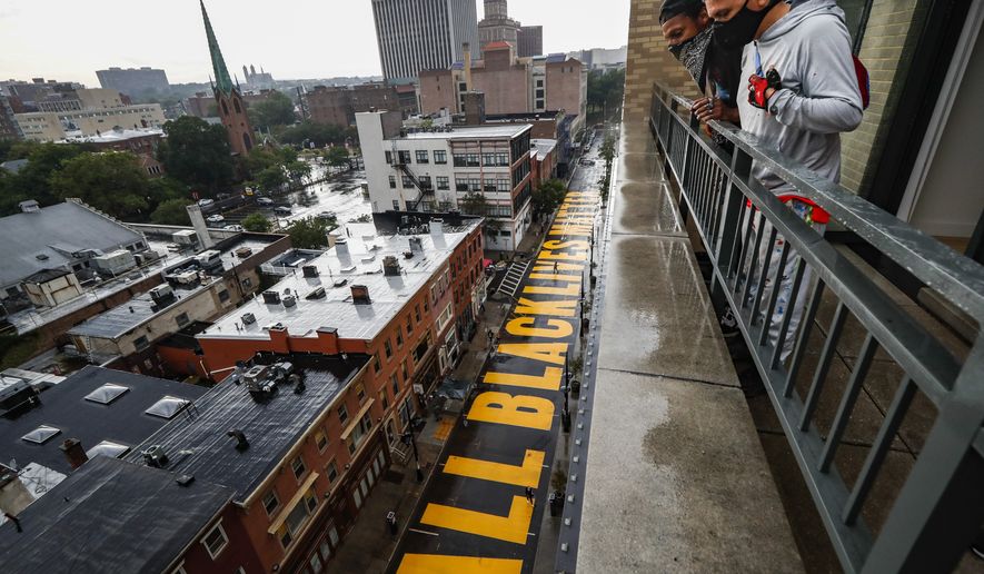 FILE - In this June 27, 2020, file photo, a mural that reads "ALL BLACK LIVES MATTER" is painted on Halsey Street in Newark, N.J. Thousands of Black activists from across the U.S. will hold the 2020 Black National Convention on Aug. 28, 2020, via livestream to produce a new political agenda that builds on the protests that followed George Floyds death. Organizers of the gathering shared their plans with The Associated Press on Wednesday, July 1, ahead of an official announcement. (AP Photo/John Minchillo, File)