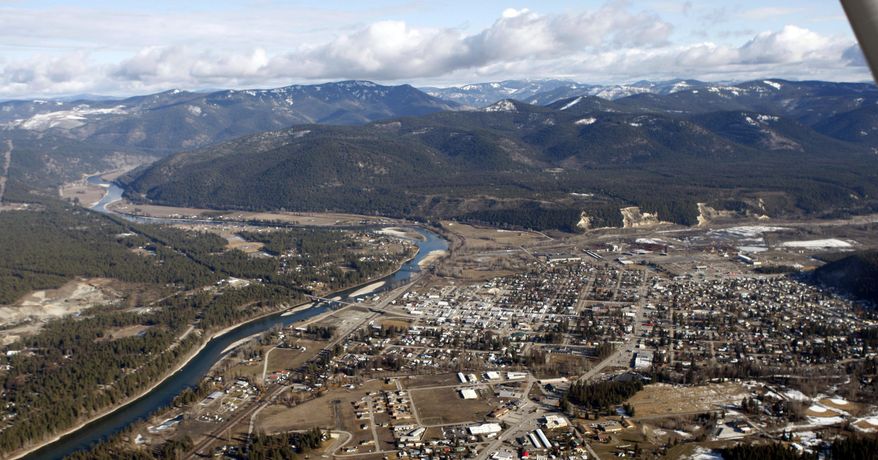 FILE - This Feb. 17, 2010, aerial file photo, shows the town of Libby Mont. With a decades-long cleanup of asbestos contamination in the town largely completed, state officials are taking over the effort to protect residents from future exposure to the potentially deadly material. (AP Photo/Rick Bowmer, File)