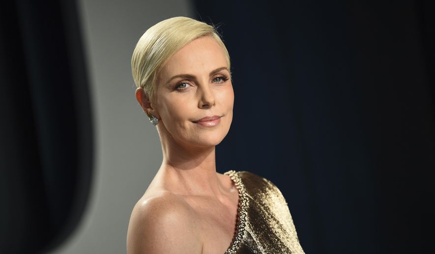 This Feb. 9, 2020, file photo shows actress Charlize Theron at the Vanity Fair Oscar Party in Beverly Hills, Calif. (Photo by Evan Agostini/Invision/AP, File)