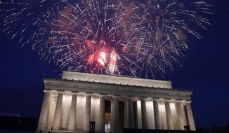FILE - In this July 4, 2019 file photo, fireworks go off over the Lincoln Memorial in Washington, Thursday, July 4, 2019. The Trump administration is promising one of the largest fireworks displays in recent memory for Washington on July 4. It also plans to give away as many as 300,000 face masks to those who come down to the National Mall, although they won&#39;t be required to wear them. (AP Photo/Susan Walsh)