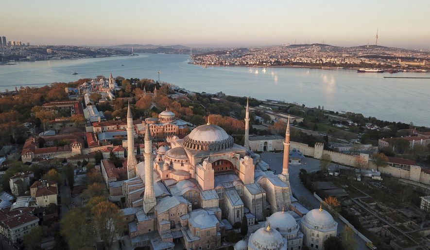 An aerial view of the Byzantine-era Hagia Sophia, one of Istanbul&#x27;s main tourist attractions in the historic Sultanahmet district of Istanbul, Saturday, April 25, 2020. The 6th-century building is now at the center of a heated debate between conservative groups who want it to be reconverted into a mosque and those who believe the World Heritage site should remain a museum. (AP Photo)