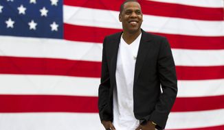 FILE - In this May 14, 2012 file photo, entertainer Shawn &amp;quot;Jay-Z&amp;quot; Carter smiles in between interviews, after a news conference at Philadelphia Museum of Art in Philadelphia. Jay-Z’s annual festival in Philadelphia, Made in America, won’t take place Labor Day weekend due to the coronavirus pandemic. In a statement Wednesday, July 1, 2020, the rap mogul’s Roc Nation company said they plan to produce the popular festival in 2021. (AP Photo/Matt Rourke, file)