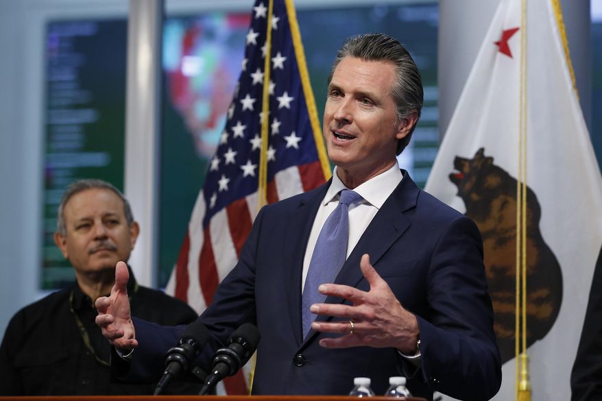 FILE - California Gov. Gavin Newsom gives an update to the state&#39;s response to the coronavirus, at the Governor&#39;s Office of Emergency Services in Rancho Cordova Calif., Tuesday, March 17, 2020. At left is Mark Ghilarducci, director of the California Office of Emergency Services, OES. California is creating roving &amp;quot;strike teams&amp;quot; drawn from seven state agencies that will enforce state guidelines designed to slow the spread of the coronavirus, Gov. Gavin Newsom said Wednesday, July 1, 2020. The strike teams will be coordinated by the state&#39;s OES strike teams. (AP Photo/Rich Pedroncelli, Pool, File)
