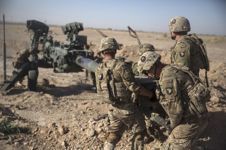 In this June 10, 2017, file photo provided by Operation Resolute Support, U.S. soldiers with Task Force Iron maneuver an M-777 howitzer, so it can be towed into position at Bost Airfield, Afghanistan. Moscow and Washington are intertwined in a complex and bloody history in Afghanistan, with both suffering thousands of dead and wounded in conflicts lasting for years. Now both superpowers are linked again over Afghanistan, with intelligence reports indicating Russia secretly offered bounties to the Taliban to kill American troops there. (U.S. Marine Corps photo by Sgt. Justin T. Updegraff, Operation Resolute Support via AP, File)