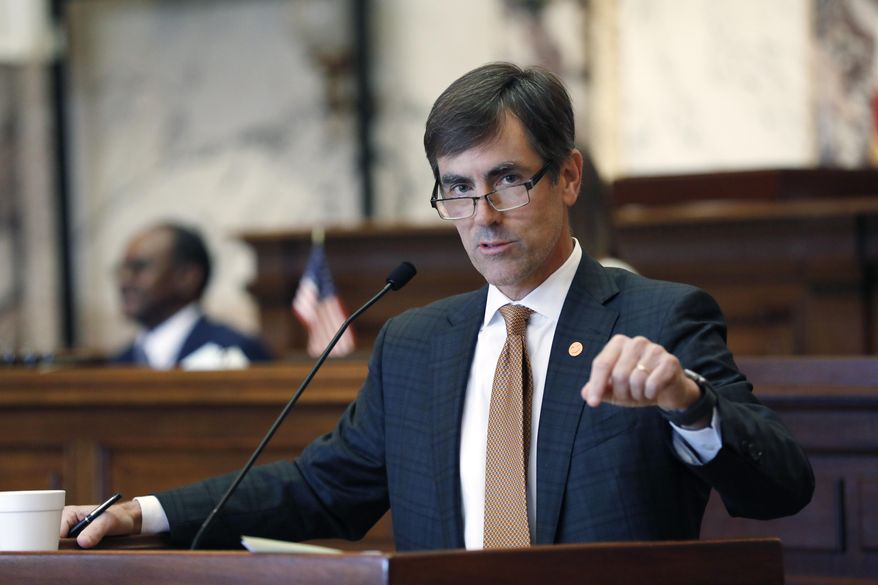 FILE - In this June 12, 2020 file photo Senate Appropriations Committee chairman Briggs Hopson, R-Vicksburg, presents an appropriation bill for debate in the Senate Chamber at the Capitol in Jackson, Miss. Mississippi government is on track to spend less during the new budget year than it did in the one that just ended, as questions remain about the economic fallout of the coronavirus pandemic. Hopson told reporters Wednesday, July 1, 2020 “I’m not aware of any agency that would actually be forced to lay off employees because of cuts". (AP Photo/Rogelio V. Solis)