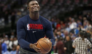 FILE - In this March 4, 2020, file photo, New Orleans Pelicans forward Zion Williamson shoots free throws prior to an NBA basketball game against the Dallas Mavericks in Dallas. Pelicans rookie Williamson says he feels like he is in good shape as he prepares to help lead New Orleans&#39; eight-game push to make the NBA playoffs. (AP Photo/Michael Ainsworth)