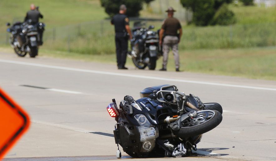The procession for fallen Tulsa Police Sgt. Craig Johnson has been involved in a collision in the westbound lanes of the Kilpatrick Turnpike, Thursday, July 2, 2020, in Oklahoma City. Three troopers in the Oklahoma Highway Patrol Motorcycle Division were injured Thursday. (Doug Hoke/The Oklahoman via AP)