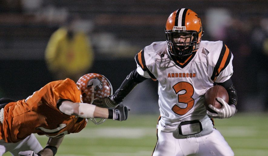 Cincinnati Anderson Redskins running back Kyle Slater (3) pushes Sylvania Southview Cougers defensive back Thomas Stichter (10) off and runs for a touchdown in the second quarter in a Division II high school state football championship game, Friday, Nov. 28, 2008, in Massillon, Ohio. (AP Photo/Tony Dejak)  **FILE**


