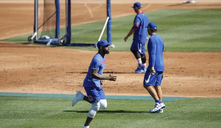 Chicago Cubs right fielder Jason Heyward warms up during baseball practice at Wrigley Field on Friday, July 3, 2020 in Chicago. (AP Photo/Kamil Krzaczynski)