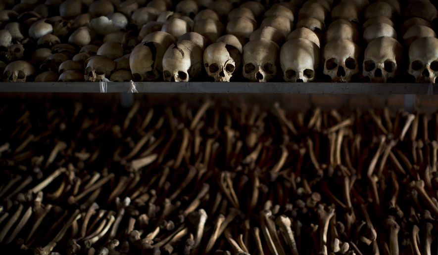 FILE - In this Friday, April 4, 2014 file photo, the skulls and bones of some of those who were slaughtered as they sought refuge inside the church are laid out as a memorial to the thousands who were killed in and around the Catholic church during the 1994 genocide in Ntarama, Rwanda. The Paris appeals court on Friday upheld a decision to end a years-long investigation into the plane crash that sparked Rwanda&#39;s 1994 genocide, citing lack of sufficient evidence. (AP Photo/Ben Curtis, File)
