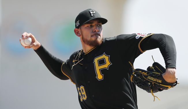 FILE - Pittsburgh Pirates starting pitcher Joe Musgrove plays during a spring training baseball game, Thursday, March 12, 2020, in Bradenton, Fla. Musgrove doesn&#x27;t like wearing a mask more than any of his Pittsburgh Pirate teammates. Yet the pitcher wore one anyway  during the first day of workouts on Friday, just one way he is trying to lead  a pitching staff searching for an ace with Jameson Taillon and Chris Archer already out for 2020. (AP Photo/Carlos Osorio)