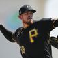FILE - Pittsburgh Pirates starting pitcher Joe Musgrove plays during a spring training baseball game, Thursday, March 12, 2020, in Bradenton, Fla. Musgrove doesn&#x27;t like wearing a mask more than any of his Pittsburgh Pirate teammates. Yet the pitcher wore one anyway  during the first day of workouts on Friday, just one way he is trying to lead  a pitching staff searching for an ace with Jameson Taillon and Chris Archer already out for 2020. (AP Photo/Carlos Osorio)