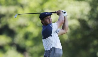 Bryson DeChambeau hits from the ninth tee during the second round of the Rocket Mortgage Classic golf tournament, Friday, July 3, 2020, at the Detroit Golf Club in Detroit. (AP Photo/Carlos Osorio)