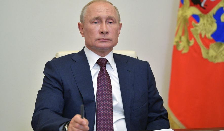 Russian President Vladimir Putin chairs a meeting with members of working group to prepare proposals on amending the Russian Constitution via teleconference in Moscow, Russia, Friday, July 3, 2020. Almost 78% of voters in Russia have approved amendments to the country's constitution that will allow President Vladimir Putin to stay in power until 2036, Russian election officials said Thursday after all the votes were counted. Kremlin critics said the vote was rigged. (Alexei Druzhinin, Sputnik, Kremlin Pool Photo via AP)