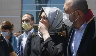 Hatice Cengiz, the fiancee of slain Saudi journalist Jamal Kashoggi, leaves a court in Istanbul, Friday, July 3, 2020, where the trial in absentia of two former aides of Saudi Crown Prince Mohammed bin Salman and 18 other Saudi nationals over the 2018 killing of the Washington Post columnist had began. Turkish prosecutors have indicted the 20 Saudi nationals over Khashoggi&#39;s grisly killing at the Saudi Consulate in Istanbul that cast a cloud of suspicion over Prince Mohammed and are seeking life prison terms for defendants who have all left Turkey. Saudi Arabia rejected Turkish demands for the suspects&#39; extradition and put them on trial in Riyadh.(AP Photo/Emrah Gurel)