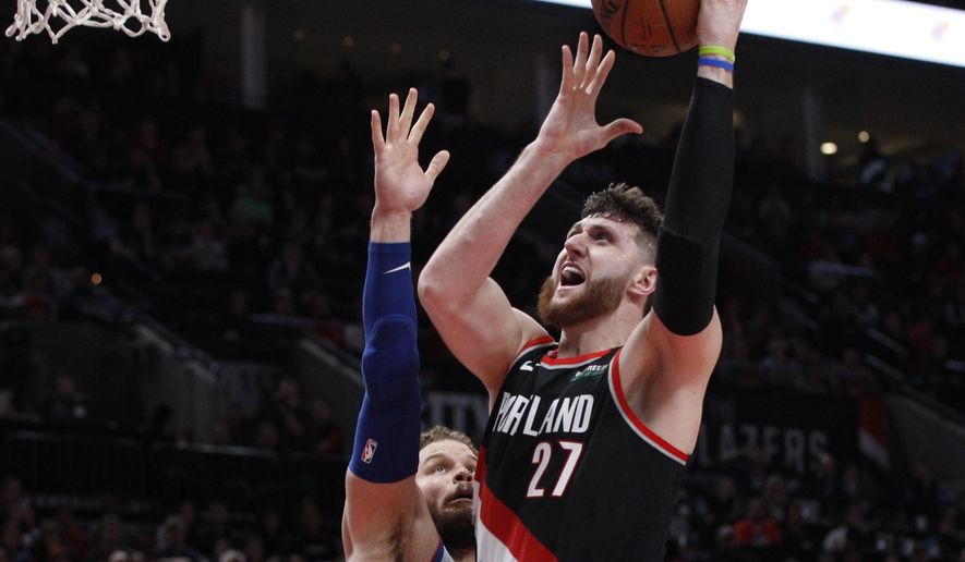 FILE - In this March 23, 2019, file photo, Portland Trail Blazers center Jusuf Nurkic, right, shoots as Detroit Pistons forward Blake Griffin defends during the second half of an NBA basketball game in Portland, Ore. Jusuf Nurkic is back and healthy. So are Zach Collins, Meyers Leonard, Giannis Antetokounmpo, Anthony Davis and plenty of others. If the four-month NBA shutdown had a silver lining, it’s that a lot of ailing players got well.  (AP Photo/Steve Dipaola, File)