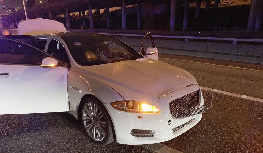 This early Saturday, July 4, 2020 photo provided by the Washington State Patrol shows the vehicle of Dawit Kelete who is suspected of driving into a protest on Interstate 5 in Seattle. Seattle has been the site of prolonged unrest following the May 25 police killing of George Floyd in Minneapolis. (Washington State Patrol via AP)