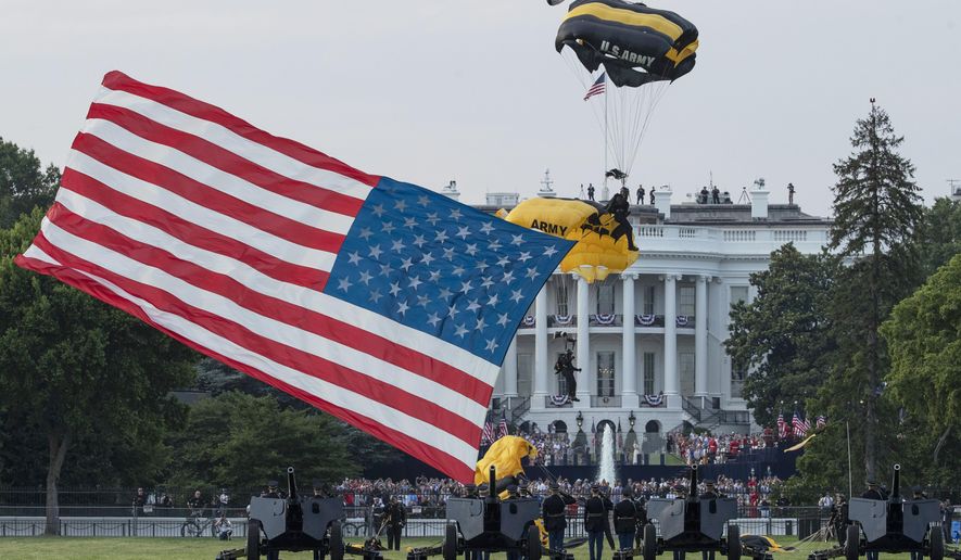 President Donald Trump and first lady Melania Trump watch as the U.S. Army Golden Knights Parachute Team descend during a &amp;quot;Salute to America&amp;quot; event on the South Lawn of the White House, Saturday, July 4, 2020, in Washington. (AP Photo/Alex Brandon)