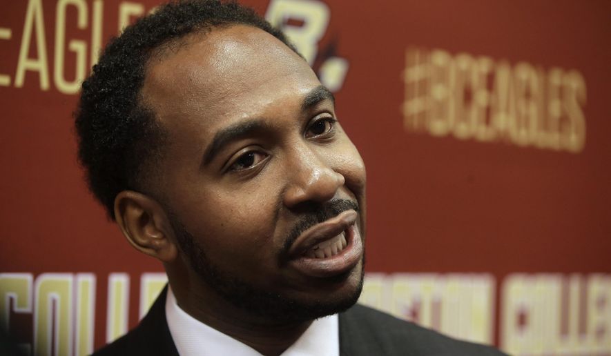 FILE - In this April 24, 2017, file photo, Martin Jarmond, newly hired Boston College athletic director, takes questions from members of the media during a news conference on the schools campus, in Boston. Most new athletic directors that take over in July have the luxury of getting acclimated to their new school before things really ramp up in two months. That is not going to be the case for the start of Jarmond's tenure at UCLA. Jarmond began in Westwood on Wednesday, July 1, 2020, after three years at Boston College. (AP Photo/Steven Senne, File)