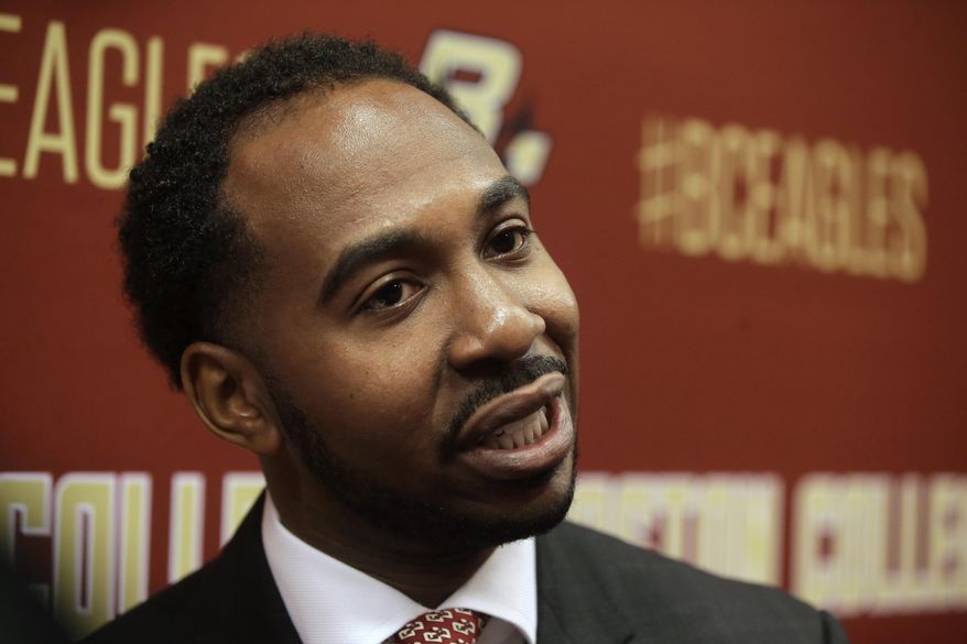 FILE - In this April 24, 2017, file photo, Martin Jarmond, newly hired Boston College athletic director, takes questions from members of the media during a news conference on the schools campus, in Boston. Most new athletic directors that take over in July have the luxury of getting acclimated to their new school before things really ramp up in two months. That is not going to be the case for the start of Jarmond's tenure at UCLA. Jarmond began in Westwood on Wednesday, July 1, 2020, after three years at Boston College. (AP Photo/Steven Senne, File)