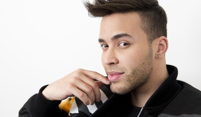 FILE - This Feb. 27, 2017 photo, singer Prince Royce poses for a photo in New York. Royce says he got a wake-up call with a COVID-19 diagnosis and now wants to try and wake others too. The Latin star told The Associated Press on Thursday that he is recovering from the virus. He says he decided to speak up out of a growing frustration with seeing people going out and gathering without protection. (Photo by Brian Ach/Invision/AP, File)