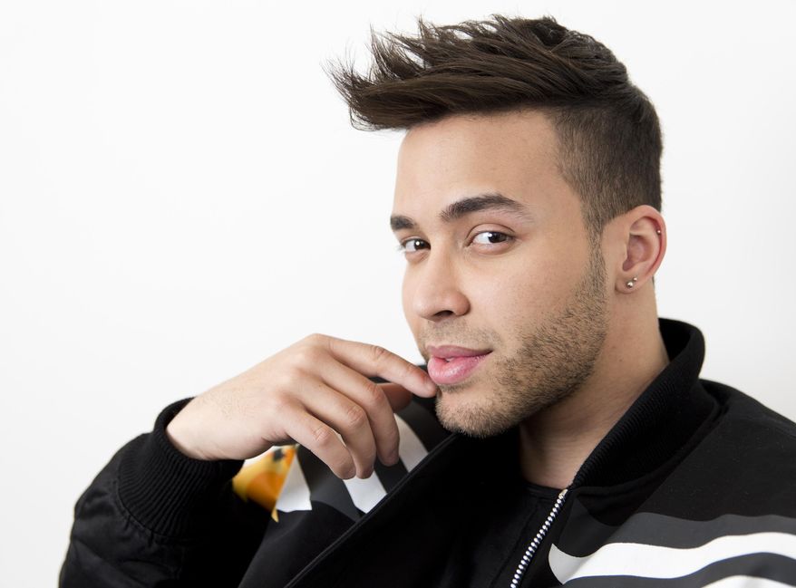 FILE - This Feb. 27, 2017 photo, singer Prince Royce poses for a photo in New York. Royce says he got a wake-up call with a COVID-19 diagnosis and now wants to try and wake others too. The Latin star told The Associated Press on Thursday that he is recovering from the virus. He says he decided to speak up out of a growing frustration with seeing people going out and gathering without protection. (Photo by Brian Ach/Invision/AP, File)