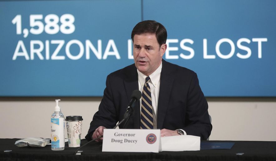 Arizona Gov. Doug Ducey updates reporters on COVID-19 in the state, during a news conference in Phoenix on Monday, June 29, 2020. Ducey ordered bars, nightclubs and water parks to close again for at least a month starting Monday night — a dramatic about-face as coronavirus cases surge in the Sunbelt. (Michael Chow/The Arizona Republic via AP, Pool)