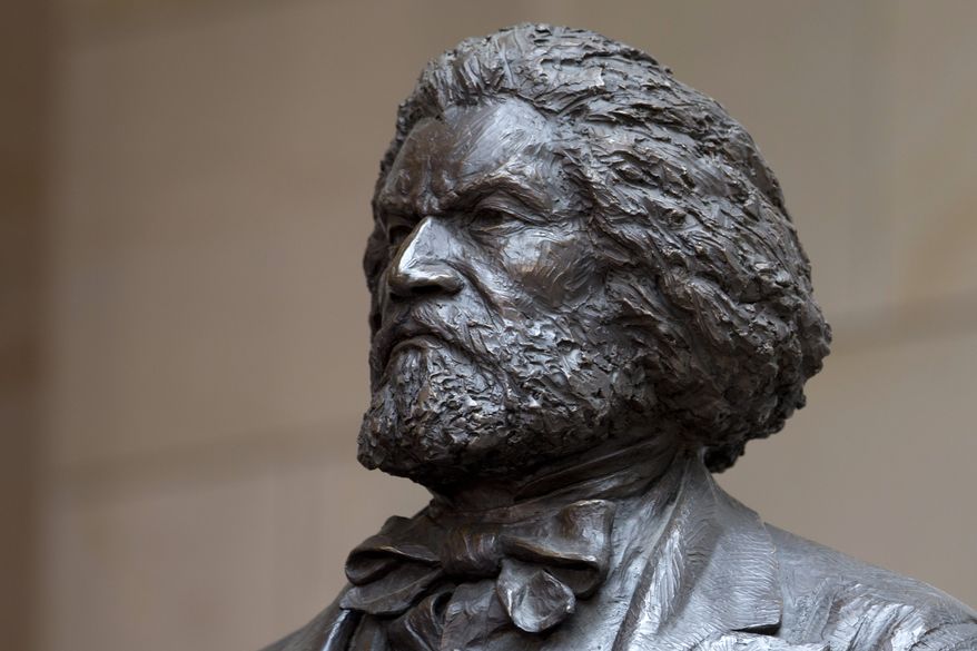 A bronze statue of 19th-century orator and writer Frederick Douglass in the Emancipation Hall of the United States Visitor Center on Capitol Hill in Washington. (AP Photo/Carolyn Kaster)
