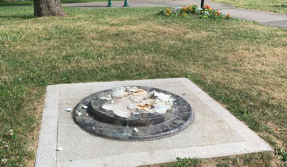 This photo provided by WROC-TV shows the remnants of a Frederick Douglass statue ripped from its base at a park in Rochester, N.Y., Sunday, July 5, 2020. The statue of abolitionist Douglass was ripped on the anniversary of one of his most famous speeches, delivered in that city in 1852. (Ben Densieski/WROC-TV via AP)