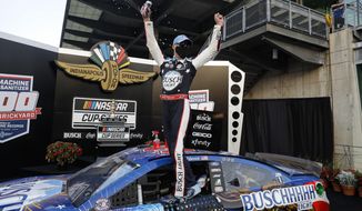 Race driver Kevin Harvick celebrates after winning the NASCAR Cup Series auto race at Indianapolis Motor Speedway in Indianapolis, Sunday, July 5, 2020. (AP Photo/Darron Cummings)