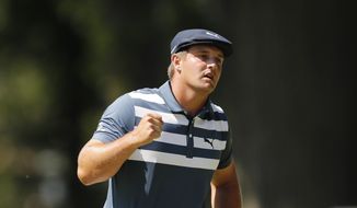 Bryson DeChambeau pumps his fist after a birdie putt on the 10th green during the final round of the Rocket Mortgage Classic golf tournament, Sunday, July 5, 2020, at Detroit Golf Club in Detroit. (AP Photo/Carlos Osorio)
