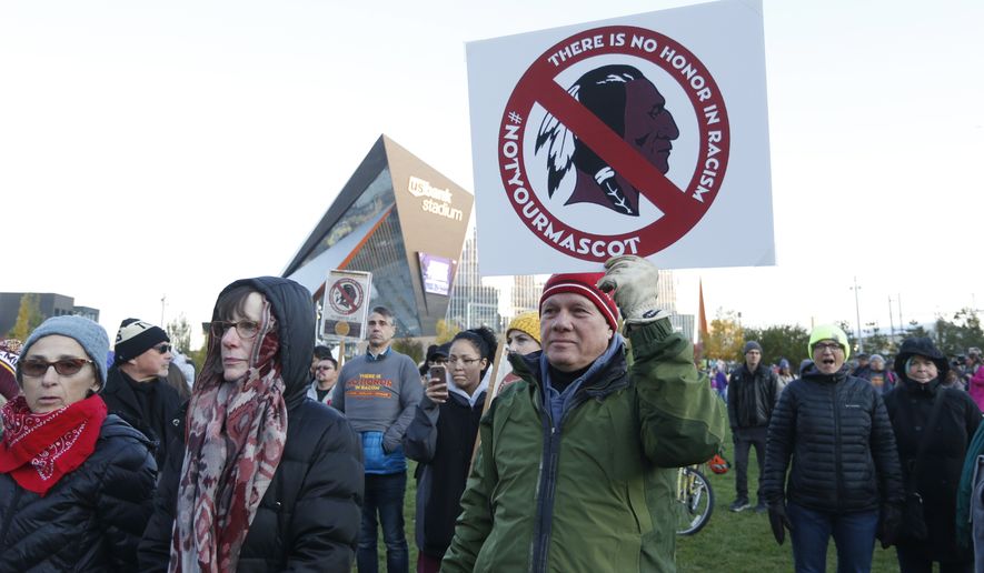 FILE - In this Oct. 24, 2019, file photo, Native American leaders protest against the Redskins team name outside U.S. Bank Stadium before an NFL football game between the Minnesota Vikings and the Washington Redskins in Minneapolis. Several Native American leaders and organizations have sent a letter to NFL Commissioner Roger Goodell calling for the league to force Washington Redskins owner Dan Snyder to change the team name immediately.  (AP Photo/Bruce Kluckhohn) ** FILE **