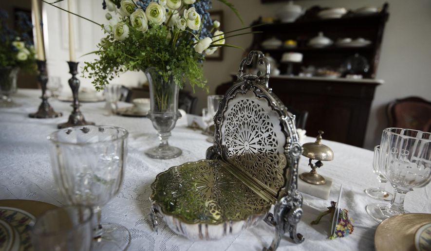 Angie Yeomans, through her son, Bob, and daughter-in-law, Gay, donated 120 items including this silver bread warmer, Tuesday, June 23, 2020 in Janesville, Wis..(Angela Major/The Janesville Gazette via AP)