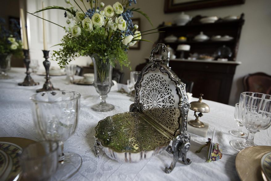 Angie Yeomans, through her son, Bob, and daughter-in-law, Gay, donated 120 items including this silver bread warmer, Tuesday, June 23, 2020 in Janesville, Wis..(Angela Major/The Janesville Gazette via AP)
