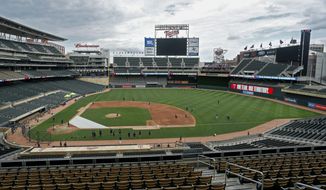 The Minnesota Twins run drills on Target Field at a baseball camp iMonday, July 6, 2020, in Minneapolis. (AP Photo/Bruce Kluckhohn)