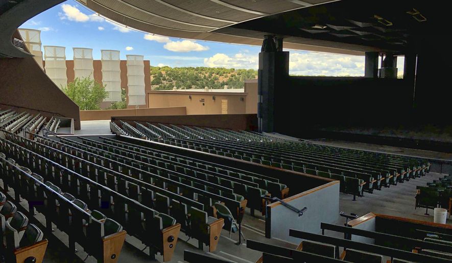 FILE - In this May 8, 2019, file photo, the Santa Fe Opera awaits its summer season in Santa Fe, N.M. The Santa Fe Opera, Meow Wolf and the non-profit organization that puts on the Albuquerque International Balloon Fiesta are among the New Mexico businesses that received loans from the federal government as part of massive effort to support the economy amid the coronavirus outbreak. (AP Photo/Morgan Lee, File)