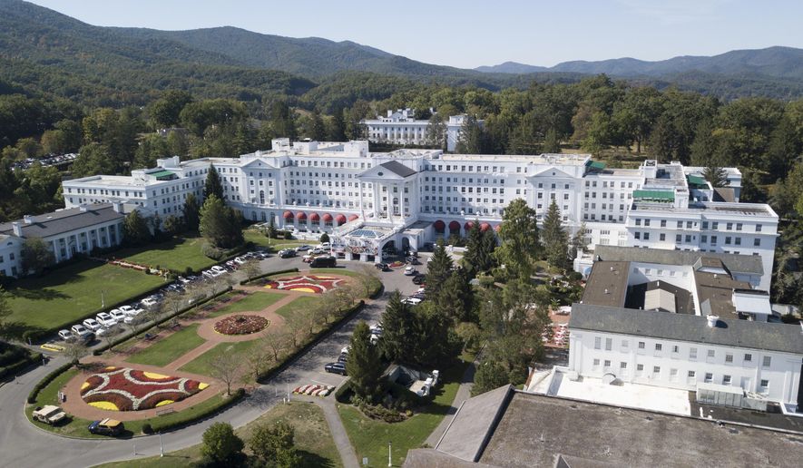 The Greenbrier resort nestled in the mountains in White Sulphur Springs, W.Va. At least six of billionaire West Virginia Gov. Jim Justice family entities received the Paycheck Protection Program loans, meant to keep small businesses afloat during the coronavirus pandemic, including the governor’s lavish resort The Greenbrier, as well as The Greenbrier Sporting Club, an exclusive members-only club linked to the resort. (AP Photo/Steve Helber, File)