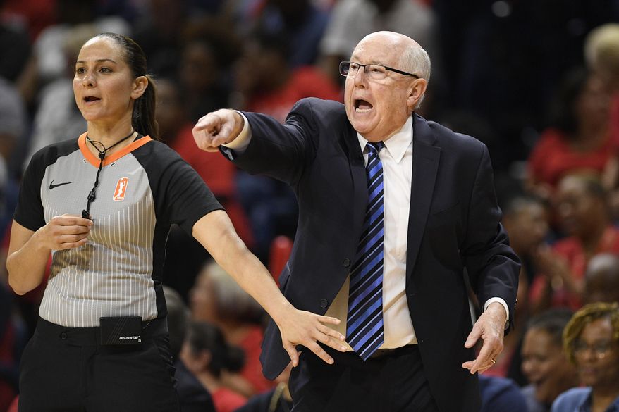 In this Sept. 17, 2019, file photo, Washington Mystics head coach Mike Thibault, right, gestures against the Las Vegas Aces during the second half of Game 1 of a WNBA playoff basketball series in Washington. Thibault knows that he could be at higher risk for severe illness if he gets the coronavirus because of his age. The 69-year-old coach didn't hesitate about going down to Florida with his team Monday, July 6, 2020, to prepare for the upcoming WNBA season. (AP Photo/Nick Wass, File) **FILE**