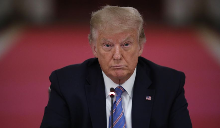 President Donald Trump listens during a "National Dialogue on Safely Reopening America's Schools," event in the East Room of the White House, Tuesday, July 7, 2020, in Washington. (AP Photo/Alex Brandon)