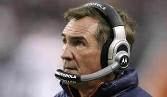 FILE - In this Nov. 25, 2007, file photo, Denver Broncos coach Mike Shanahan watches his team during the first quarter of an NFL football game against the Chicago Bears in Chicago. Shanahan has been elected to the Denver Broncos Ring of Fame and will be inducted in 2021 because of COVID-19 precautions. Shanahan was coach from 1995-2008 after serving as a Broncos assistant from 1984-87 and 1989-91. (AP Photo/M. Spencer Green, File)